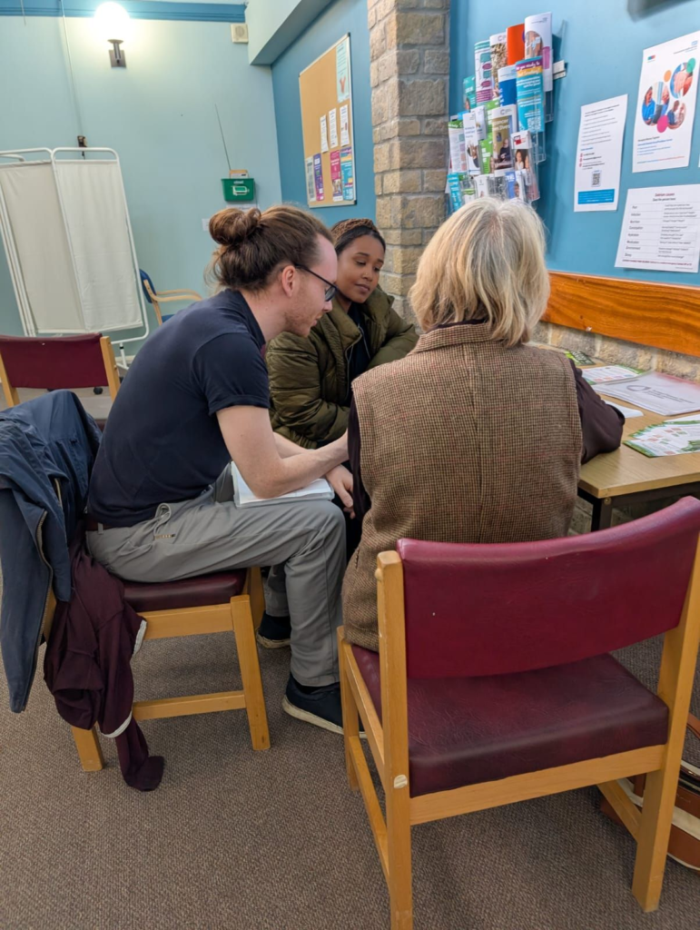 Three people sitting at a table